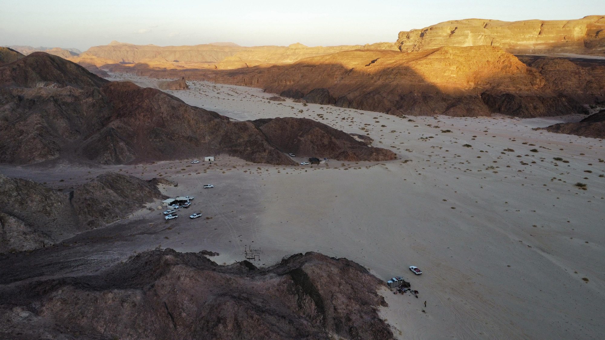 Aerial view of a desert wadi at golden hour