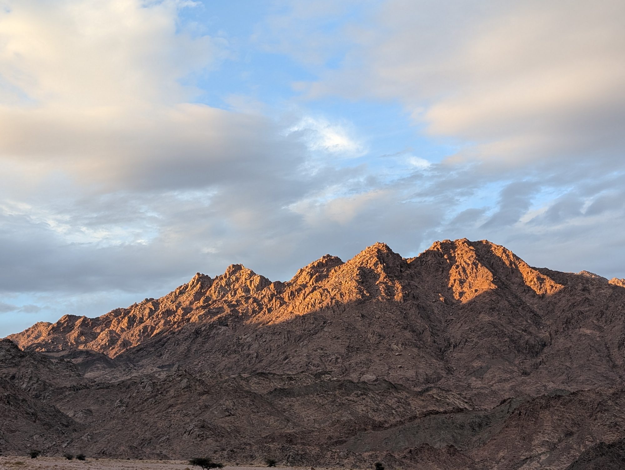 Orange mountain peaks at dusk